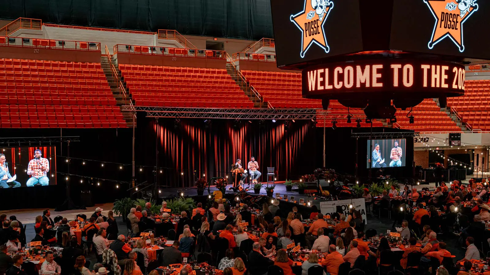 crowd of people sitting at tables