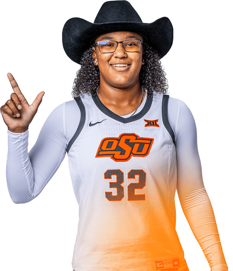 Woman holding up hand in a basketball jersey